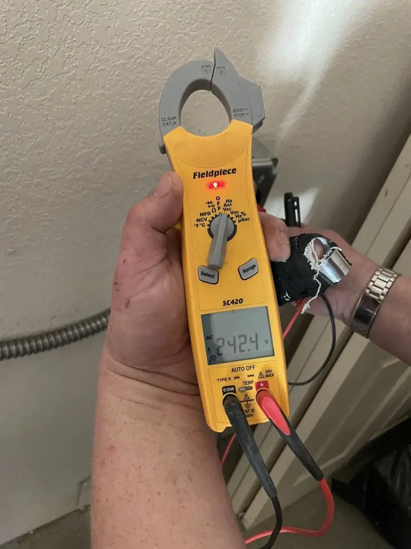 Voltage testing with clamp meter during Whole House Surge Protector in Valdosta